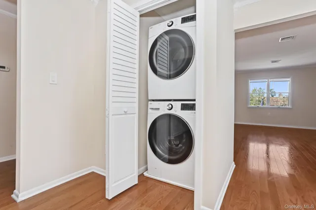 a view of a hallway with washer and dryer