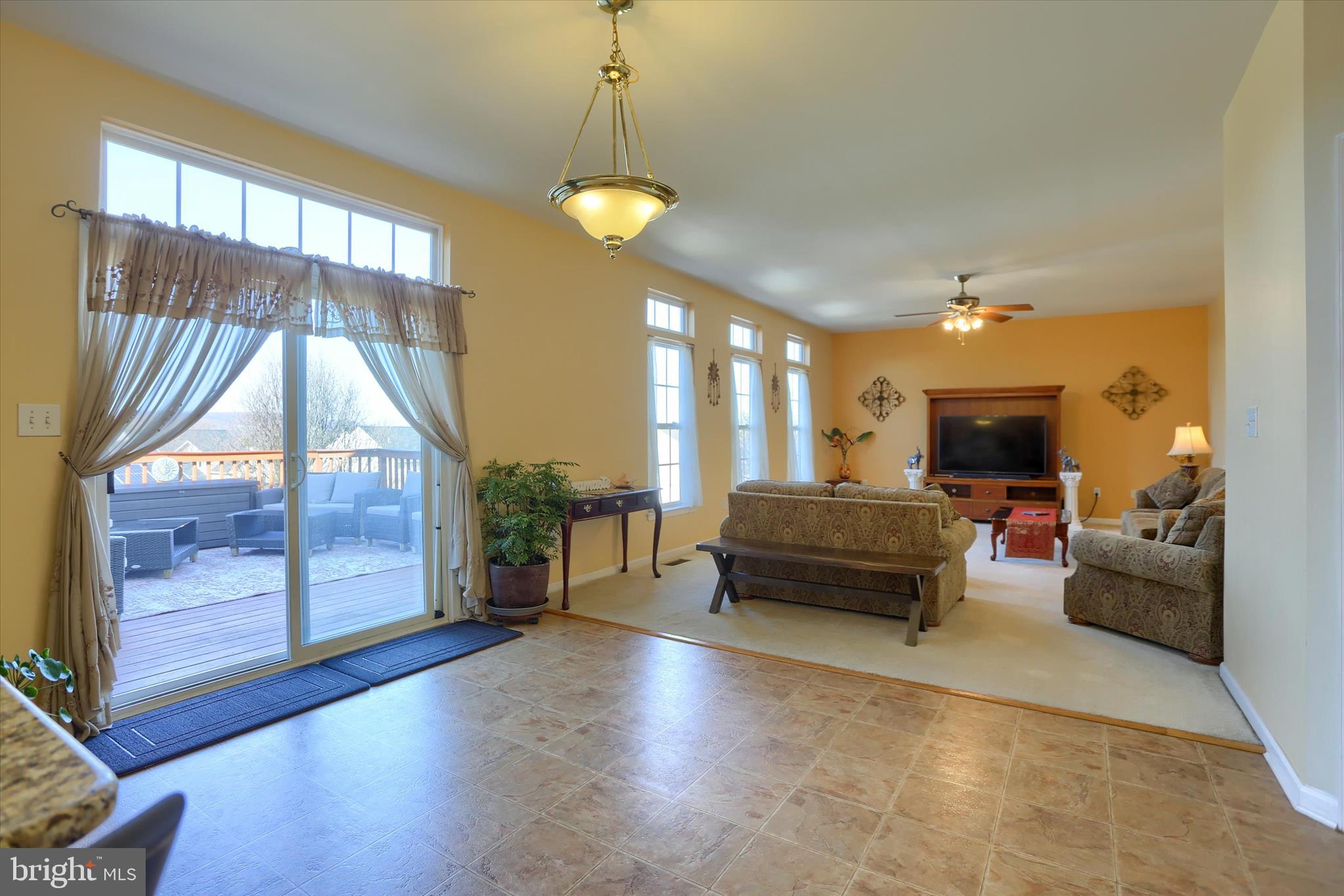 409 Wynwood Road York, PA 17402 - Photo 16 of 64 a living room with furniture and a chandelier