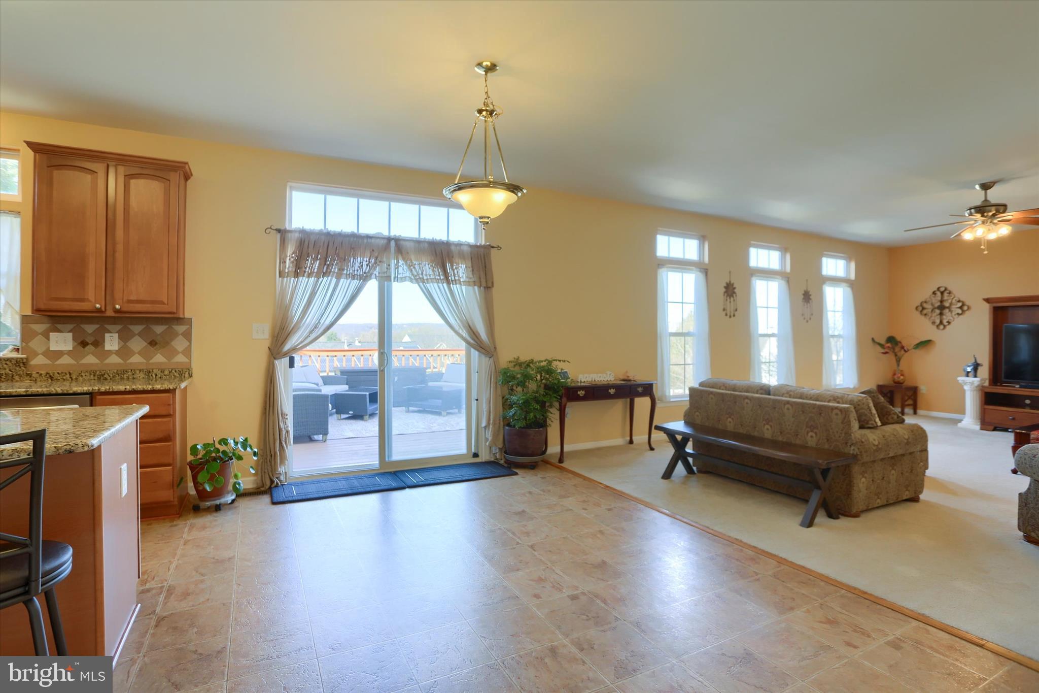 409 Wynwood Road York, PA 17402 - Photo 21 of 64 a living room with furniture a fireplace and a chandelier