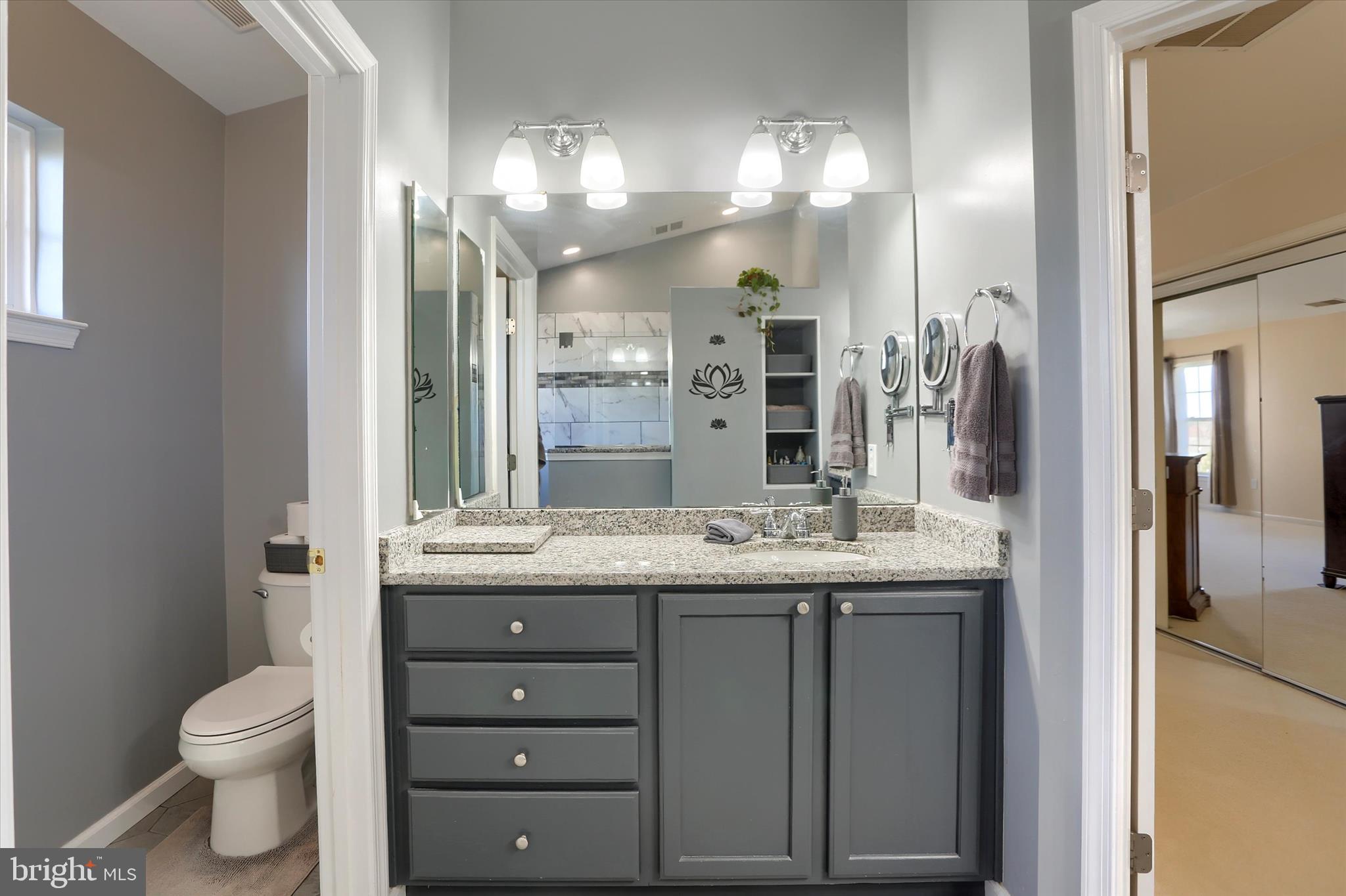 409 Wynwood Road York, PA 17402 - Photo 38 of 64 a bathroom with a granite countertop sink toilet and a mirror