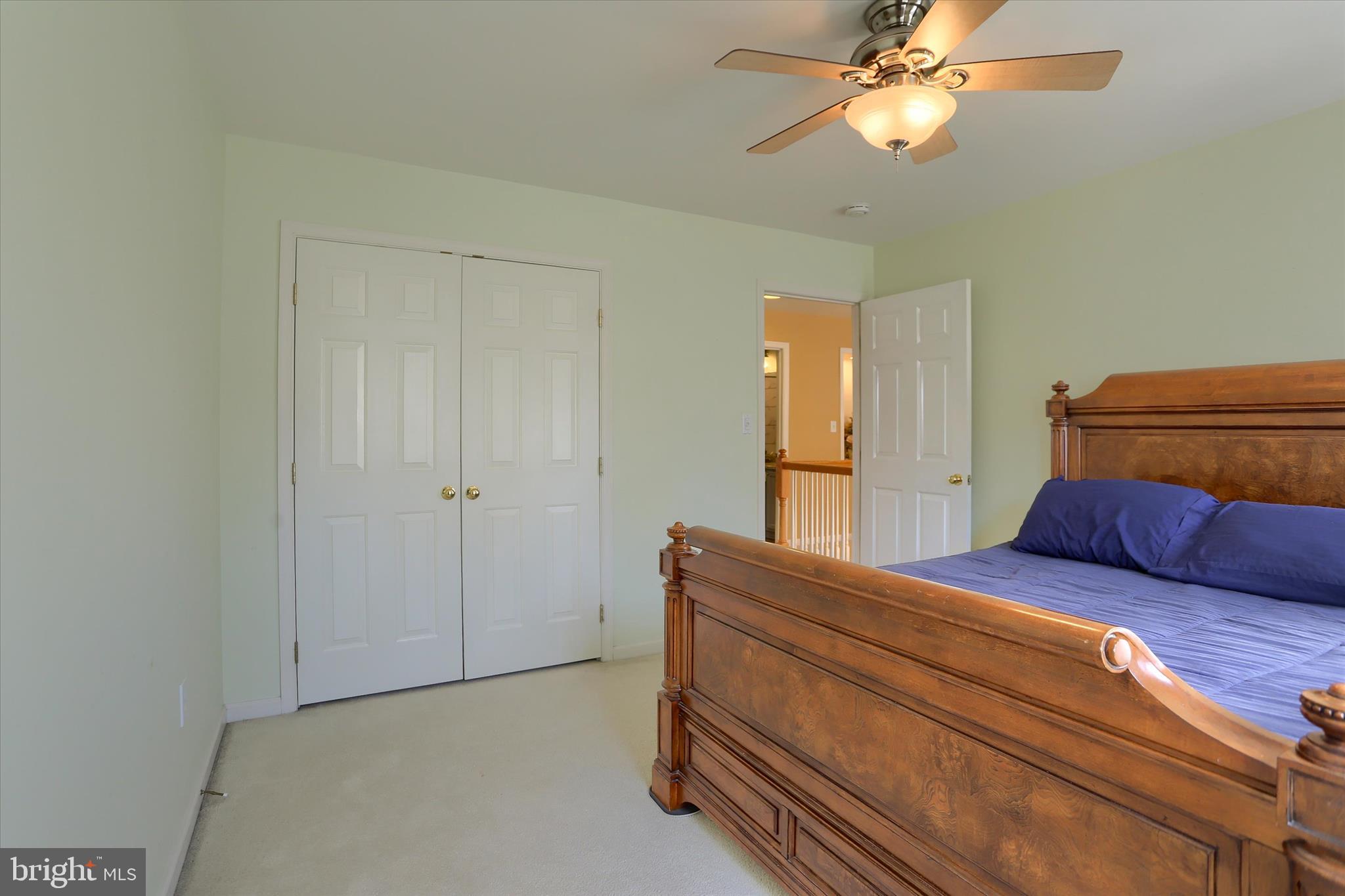 409 Wynwood Road York, PA 17402 - Photo 44 of 64 a bedroom with a bed and a chandelier