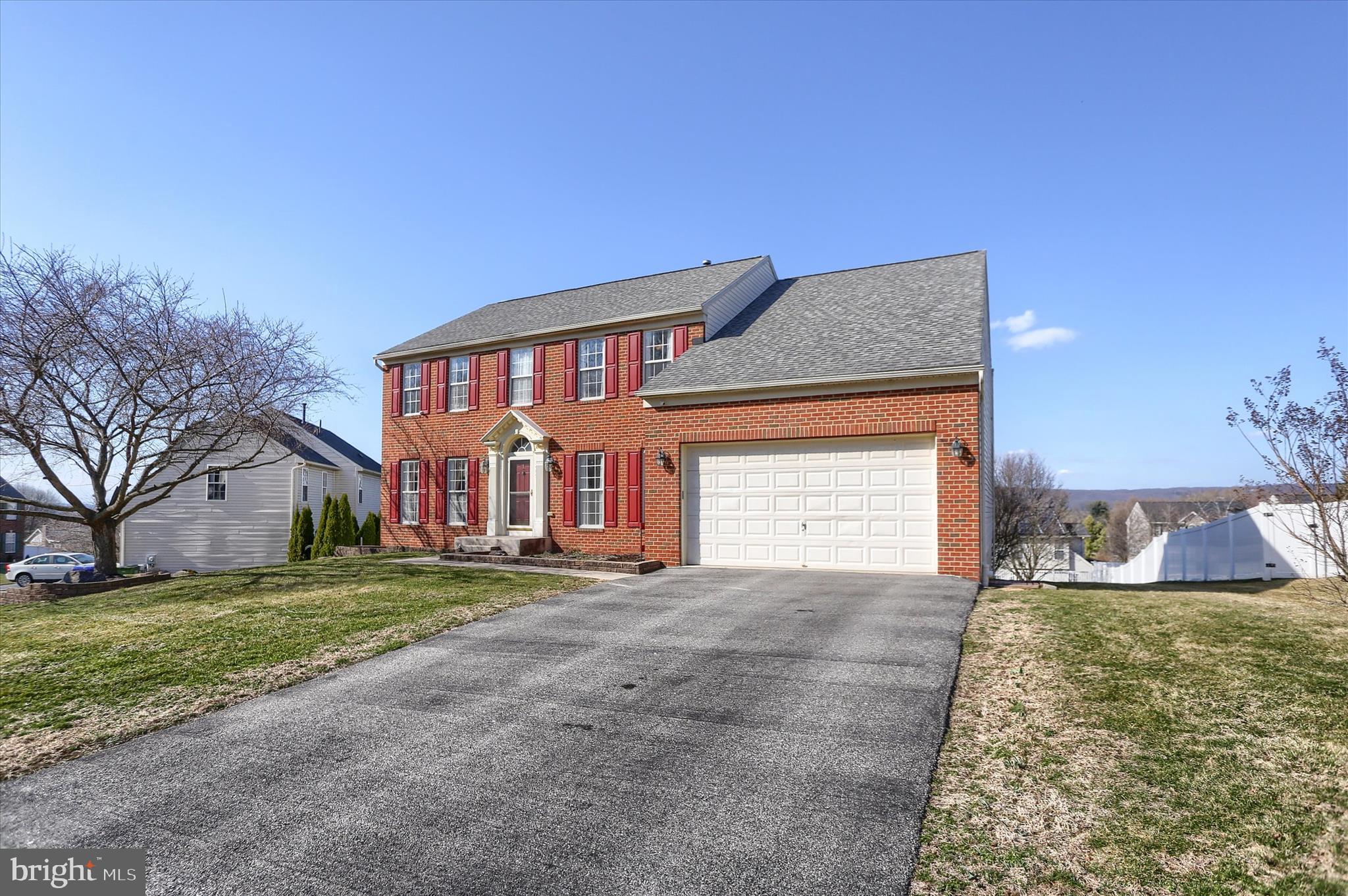 409 Wynwood Road York, PA 17402 - Photo 7 of 64 a view of a house with a yard and garage