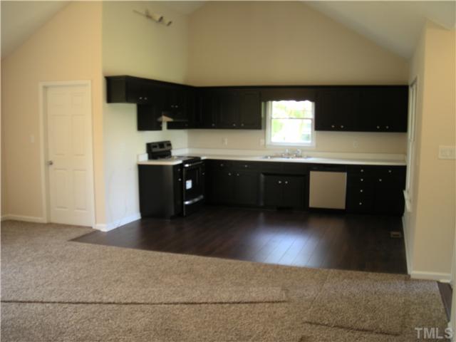 1334 Langdon Road Angier, NC 27501 - Photo 11 of 11 a kitchen with stainless steel appliances granite countertop a sink and a stove