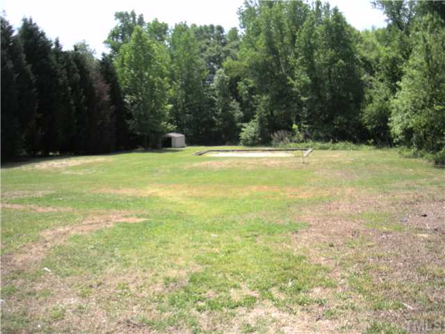 1334 Langdon Road Angier, NC 27501 - Photo 2 of 11 a view of a swimming pool with an outdoor space
