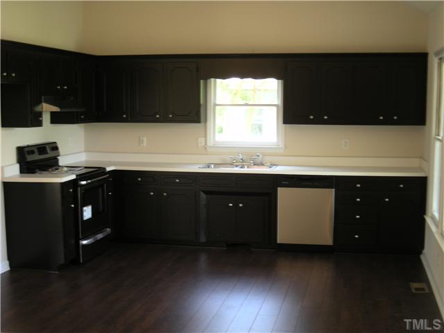 1334 Langdon Road Angier, NC 27501 - Photo 4 of 11 a kitchen with a sink and a stove
