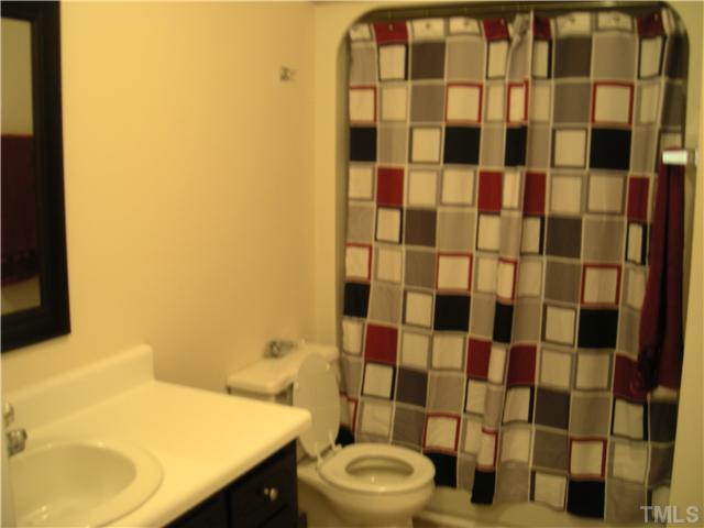 1334 Langdon Road Angier, NC 27501 - Photo 7 of 11 a bathroom with a sink toilet and shower