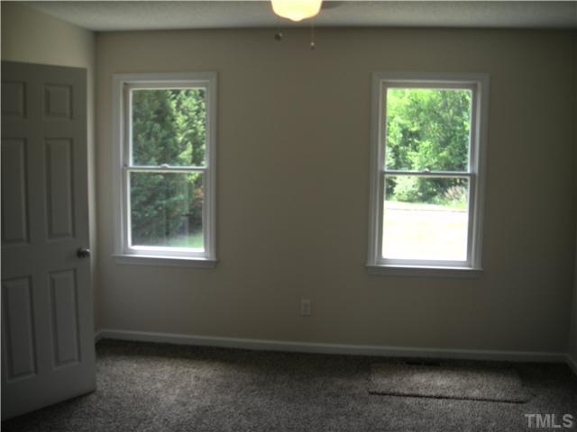 1334 Langdon Road Angier, NC 27501 - Photo 8 of 11 a view of an empty room with a window