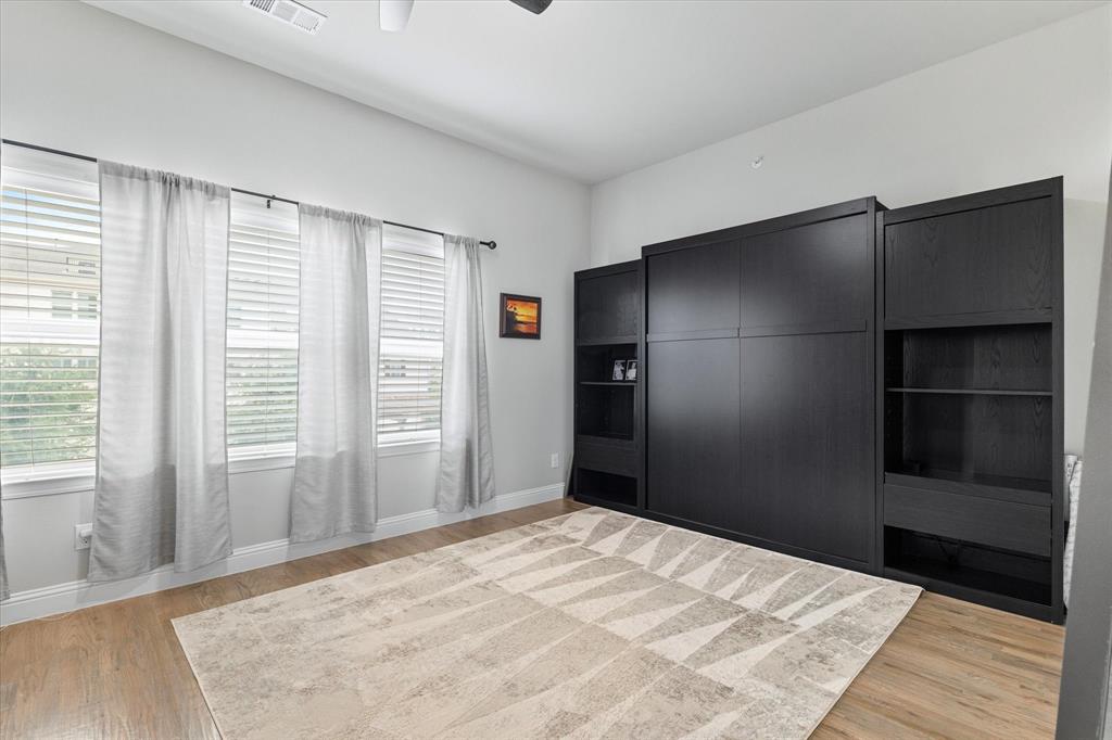 6013 Page Street Frisco, TX 75034 - Photo 14 of 39 a bedroom with a bed and a window