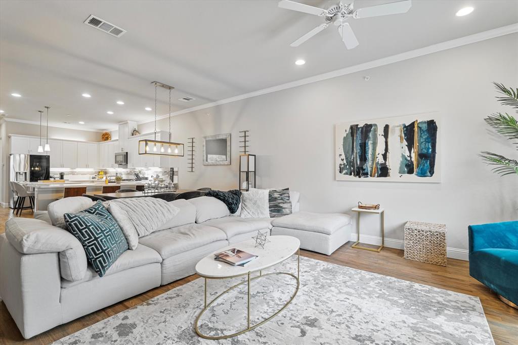 6013 Page Street Frisco, TX 75034 - Photo 23 of 39 a living room with furniture kitchen view and a table