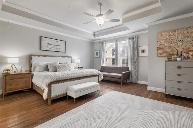 a living room with furniture a clock and a table