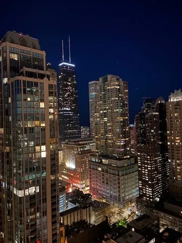 a view of a glass door with a tree