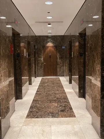 a lobby with a glass door shower and yard