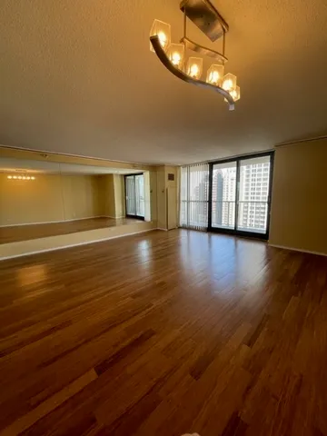 a view of a livingroom with wooden floor