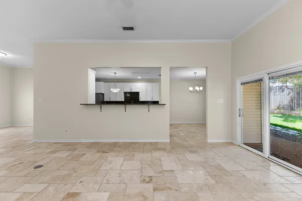 a view of a hallway with wooden shelves
