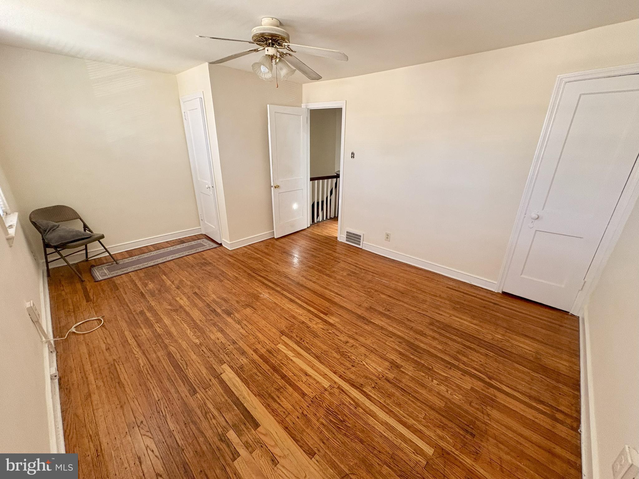 1072 South Merrimac Road Camden, NJ 08104 - Photo 11 of 14 Spacious room with warm wooden floors.
