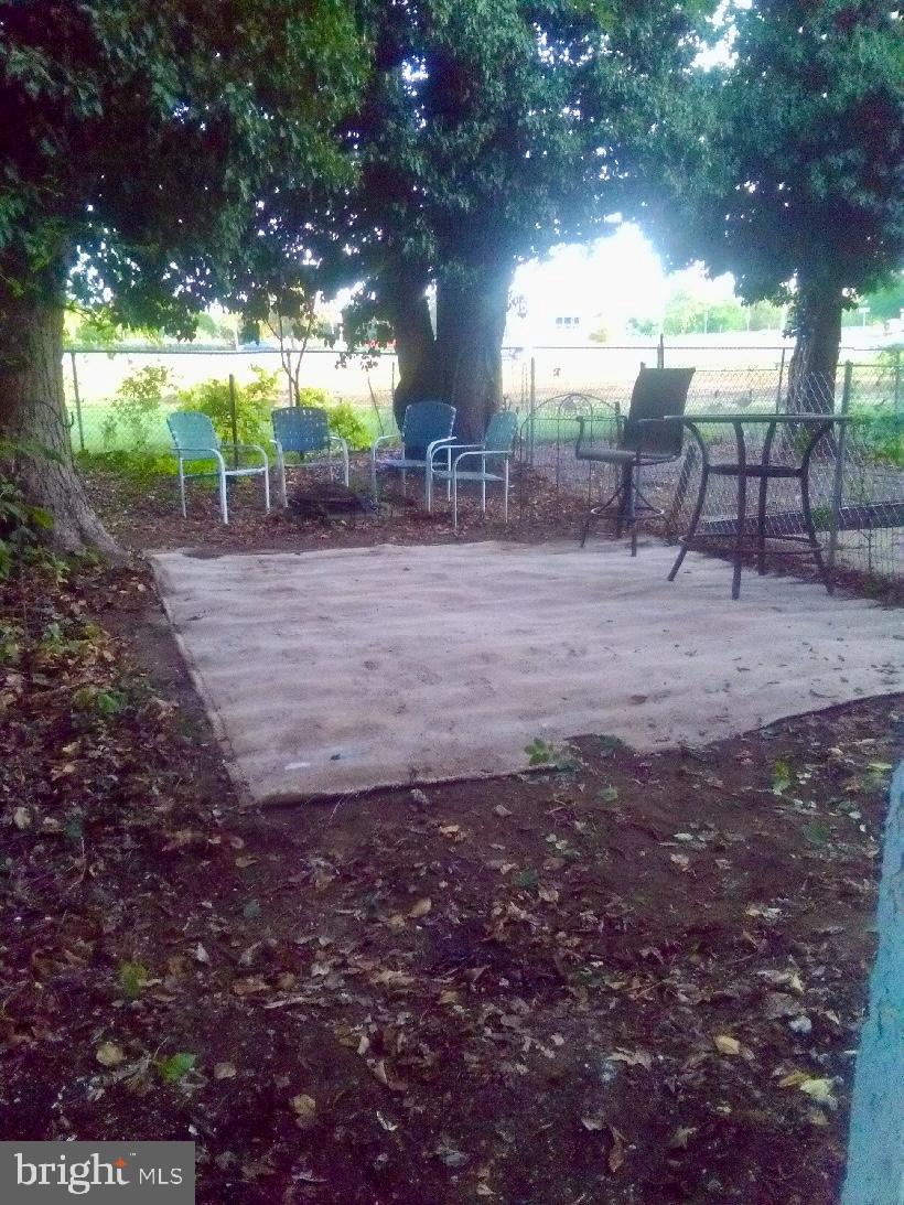 1072 South Merrimac Road Camden, NJ 08104 - Photo 14 of 14 Tranquil outdoor retreat under leafy trees.