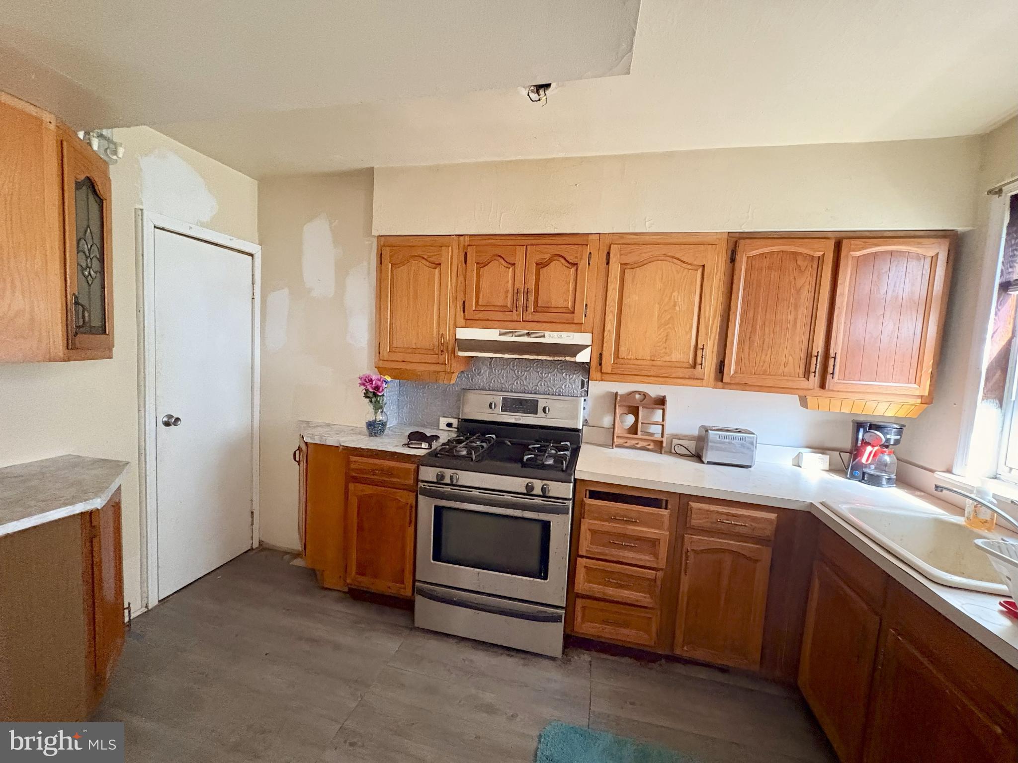 1072 South Merrimac Road Camden, NJ 08104 - Photo 6 of 14 Warm wooden cabinetry in a cozy kitchen.