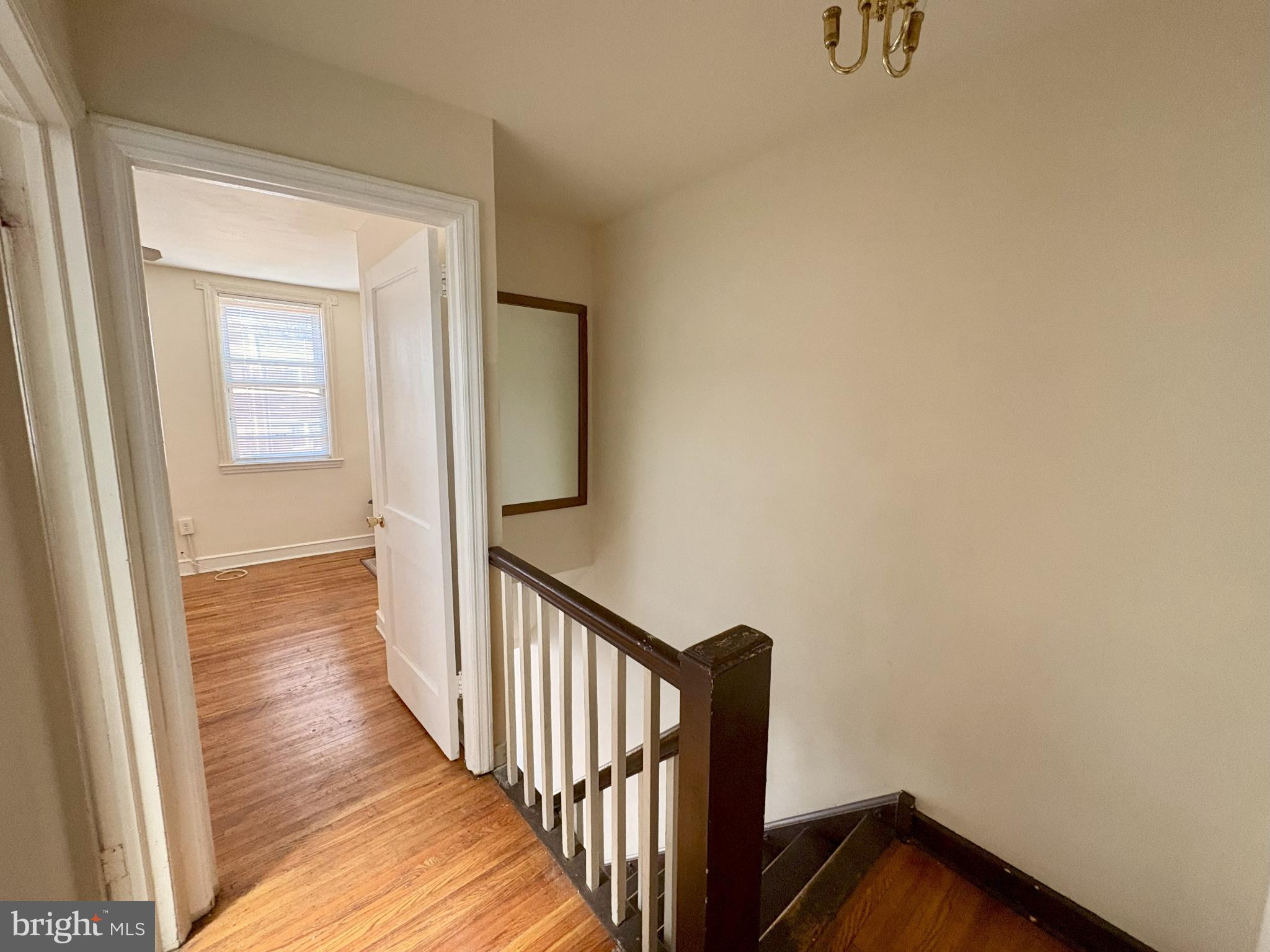 1072 South Merrimac Road Camden, NJ 08104 - Photo 8 of 14 Bright and inviting staircase entrance.