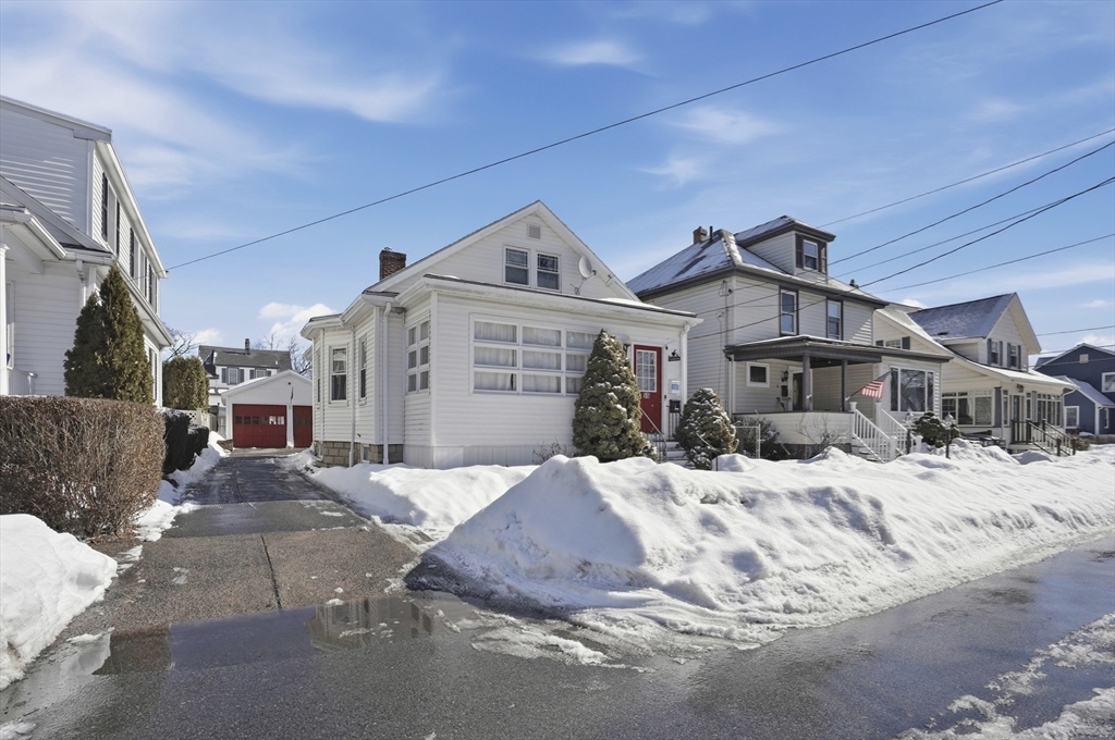 55 Addison Avenue Lynn, MA 01902 - Photo 23 of 23 a view of a house with a snow in the background