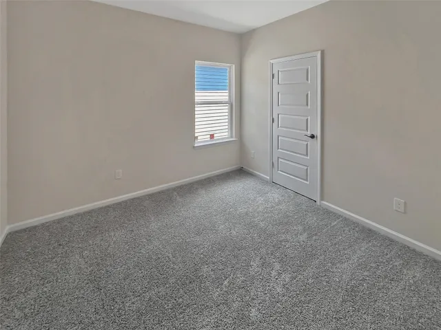 an empty room with closet area