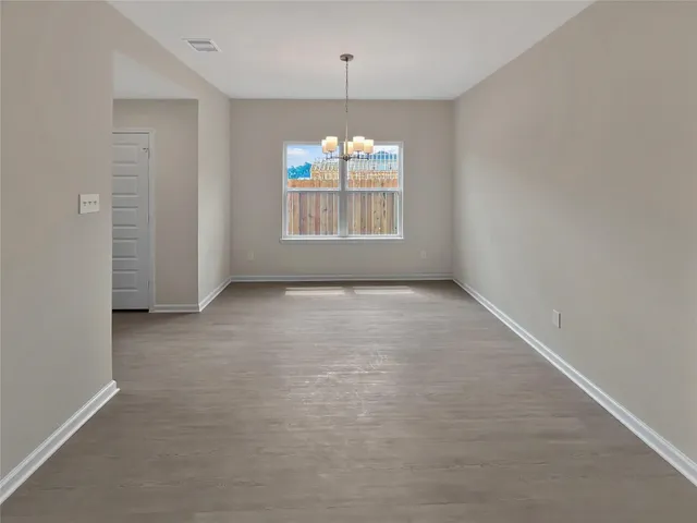 a kitchen with a sink a counter top space stainless steel appliances and cabinets