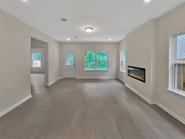 a view of kitchen and kitchen with furniture wooden floor