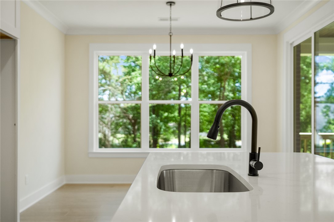 100 Garden Gate Drive Anderson, SC 29621 - Photo 15 of 43 This bright kitchen features a large window with lush views and a modern island with an integrated sink.