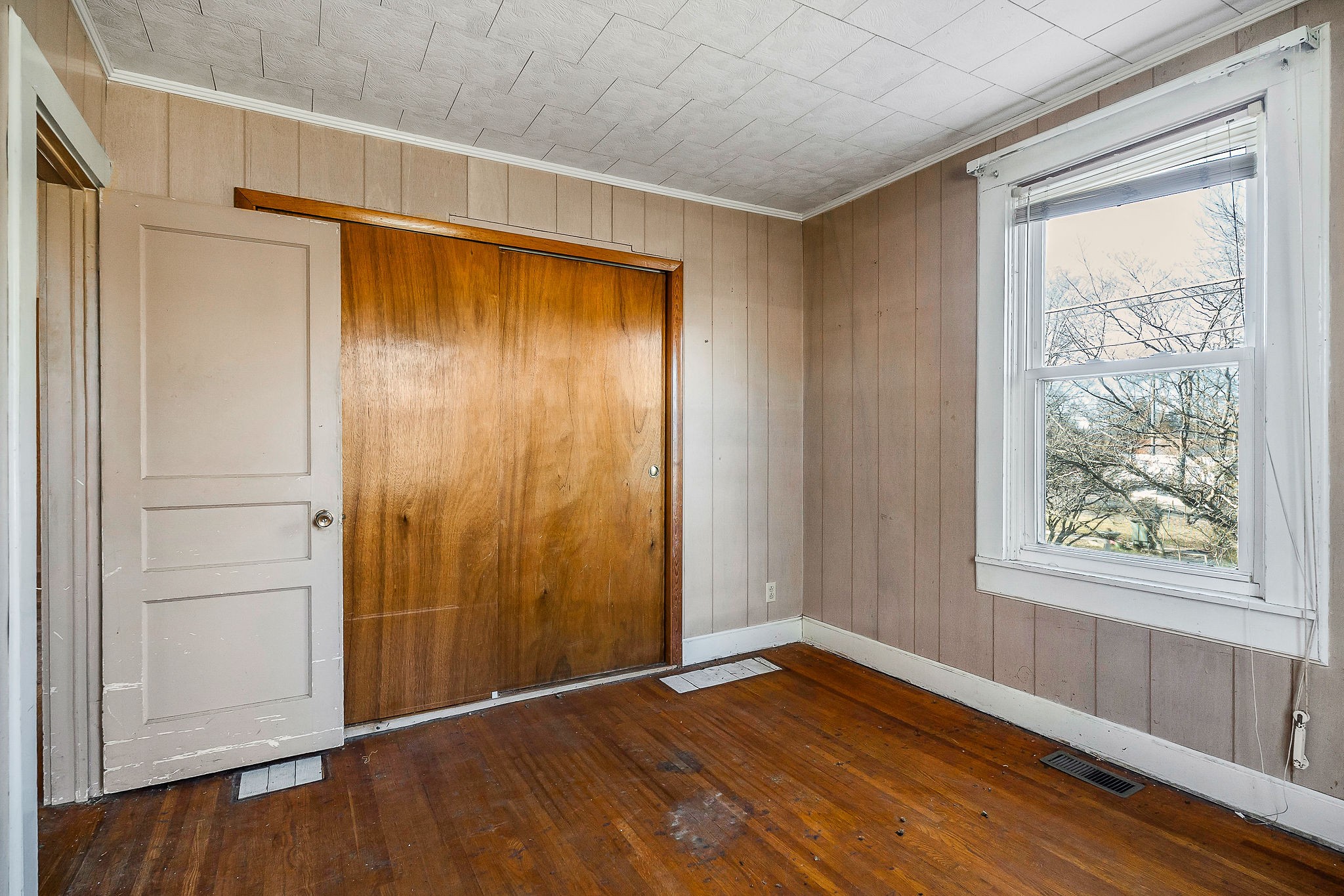 304 South Young Street Sparta, TN 38583 - Photo 16 of 20 a view of an empty room with wooden floor and a window