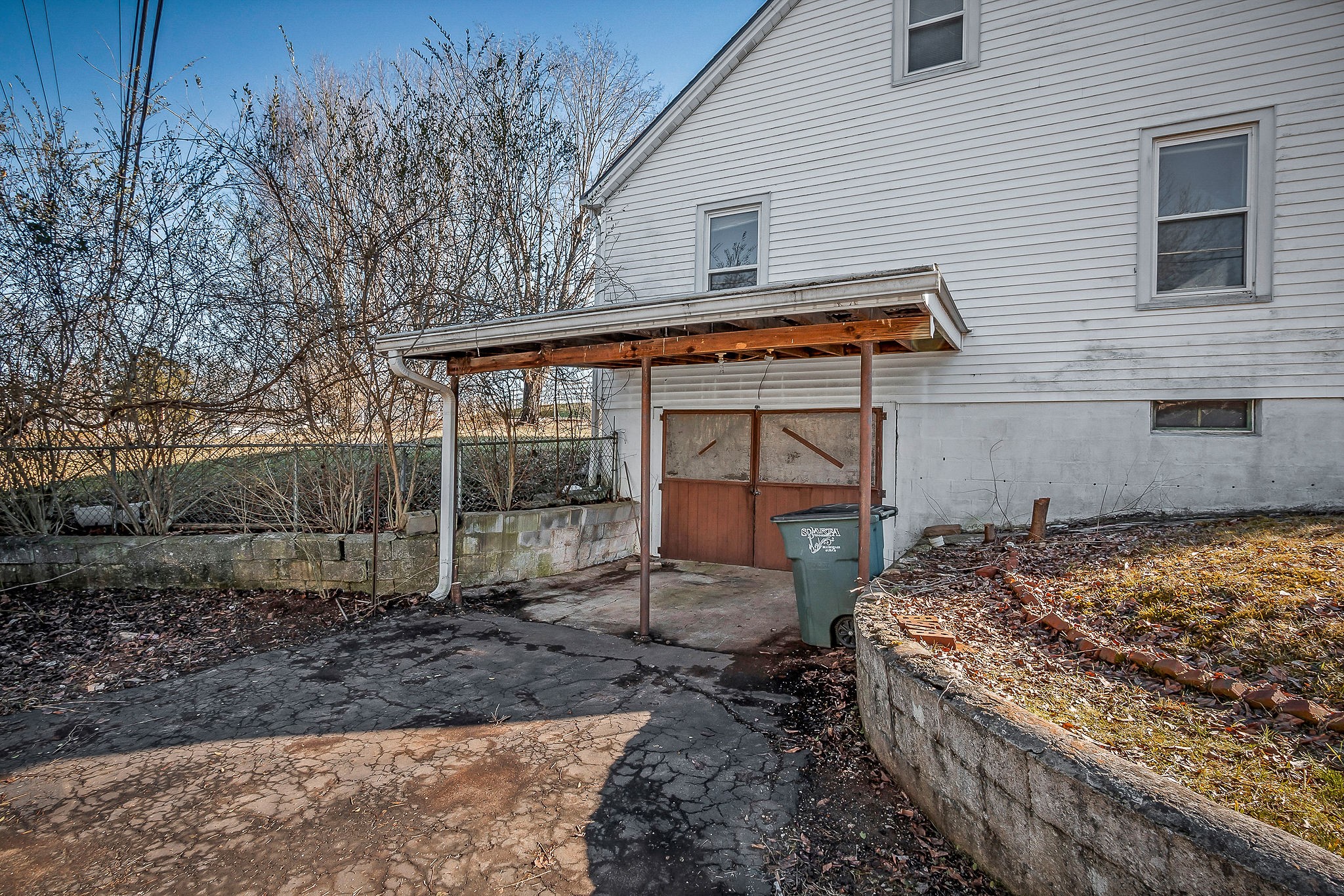 304 South Young Street Sparta, TN 38583 - Photo 8 of 20 a backyard of a house with barbeque oven table and chairs