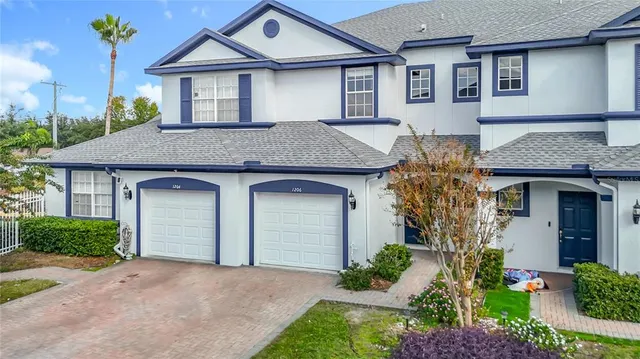 a view of a hallway with wooden floor and entryway