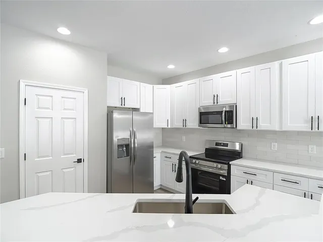 a view of a kitchen with wooden floor