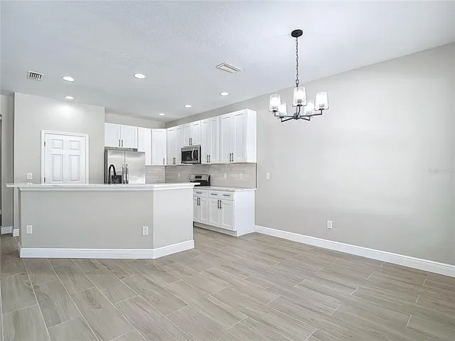 an empty room with wooden floor