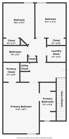 a bedroom with a bed and a potted plant