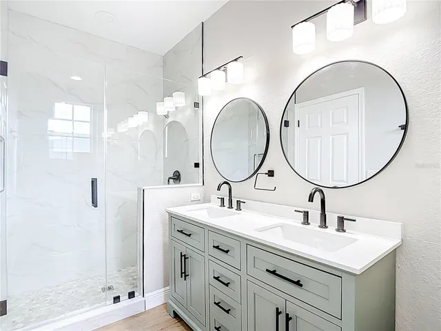 a view of a storage & utility room with two washing machine