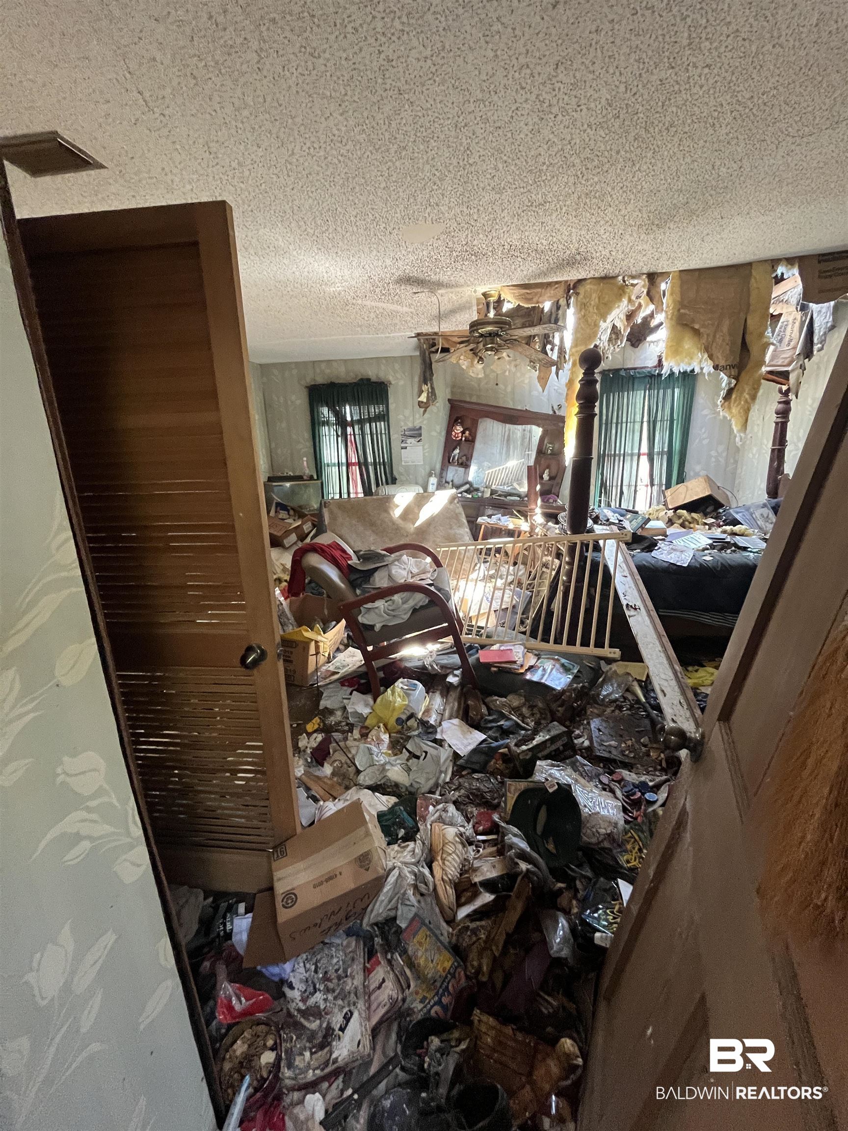 108 Powell Avenue Bay Minette, AL 36507 - Photo 24 of 39 Misc room featuring wallpapered walls and a textured ceiling
