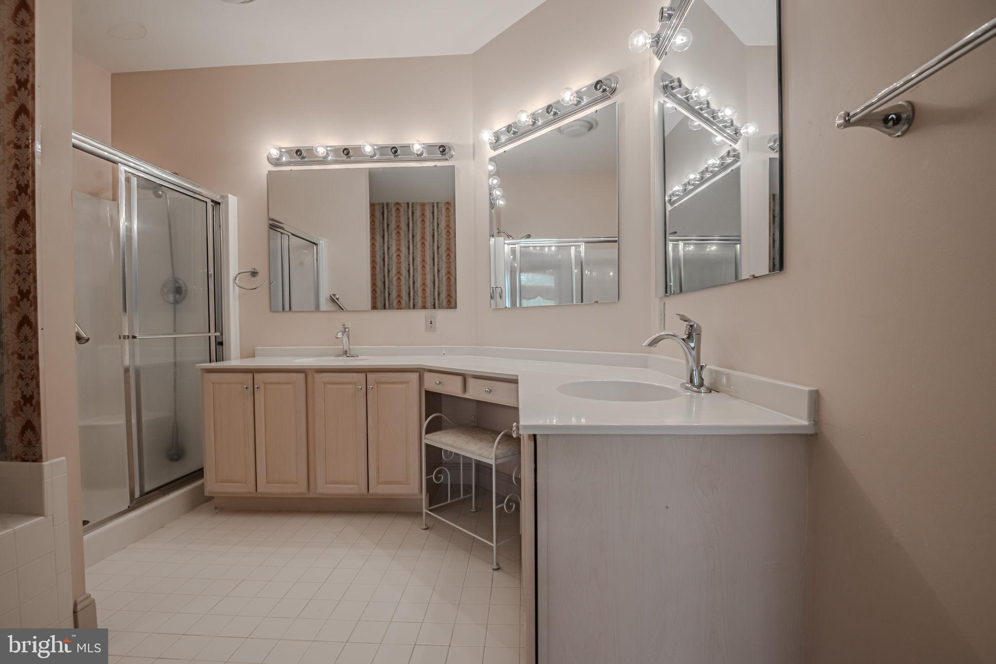 25 Fall Brooke Road Newark, DE 19711 - Photo 26 of 54 a bathroom with a sink double vanity and a mirror