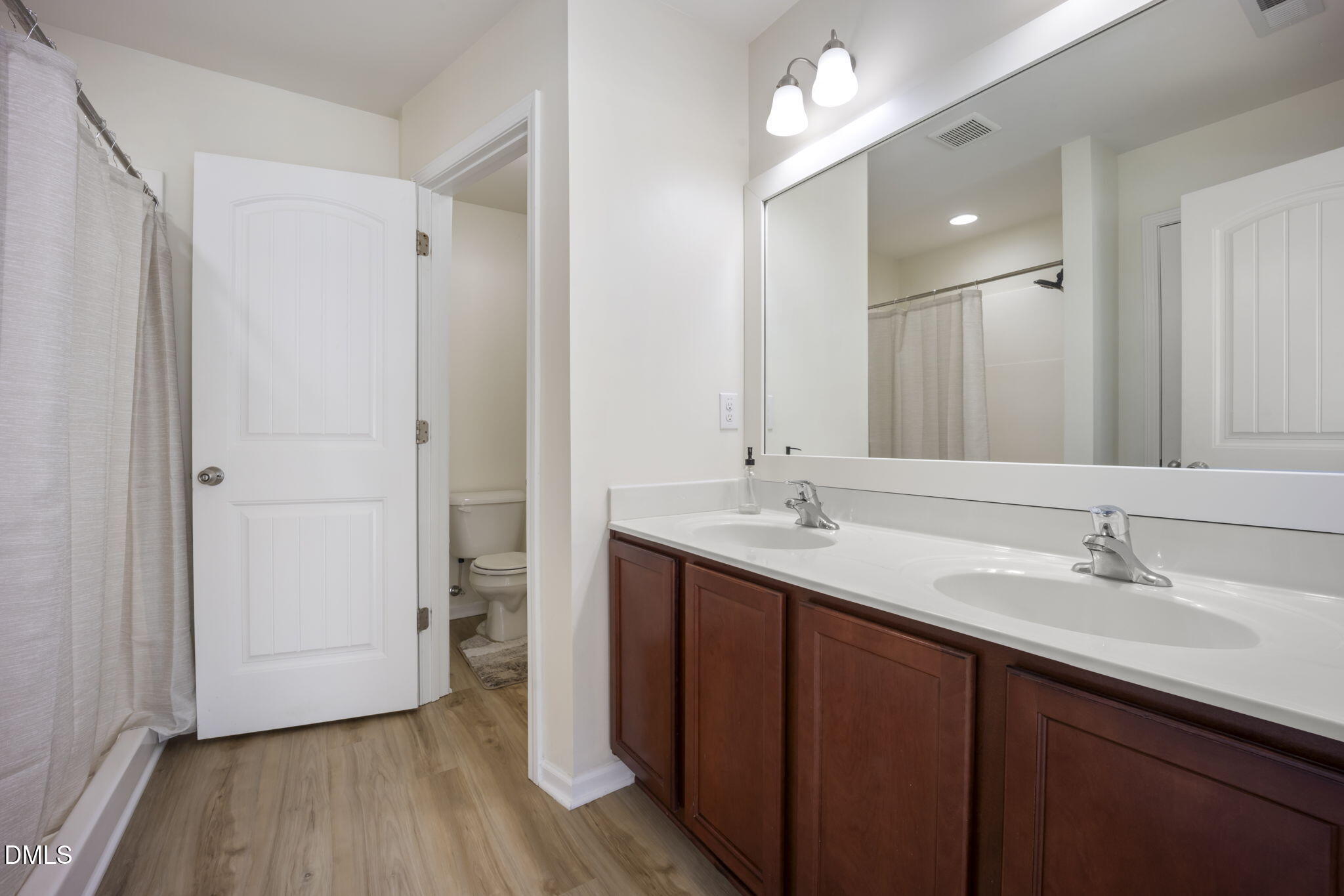 201 Leighann Ridge Lane Rolesville, NC 27571 - Photo 24 of 48 Primary Bathroom with Full Shower, Water Closet, New LVP Flooring, Newly Framed Mirror & Linen Closet.