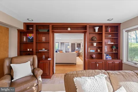 a kitchen with stainless steel appliances granite countertop a sink refrigerator and cabinets