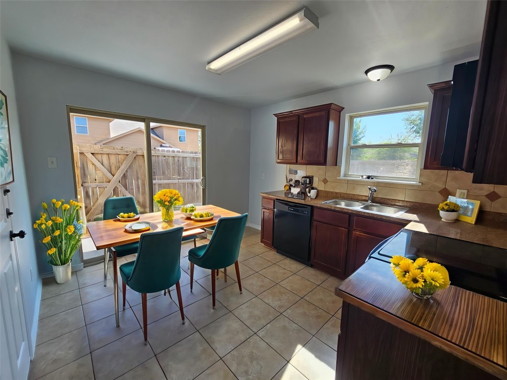 154 Sierra Rose Loop Georgetown, TX 78626 - Photo 3 of 13 a kitchen with a table and chairs in it