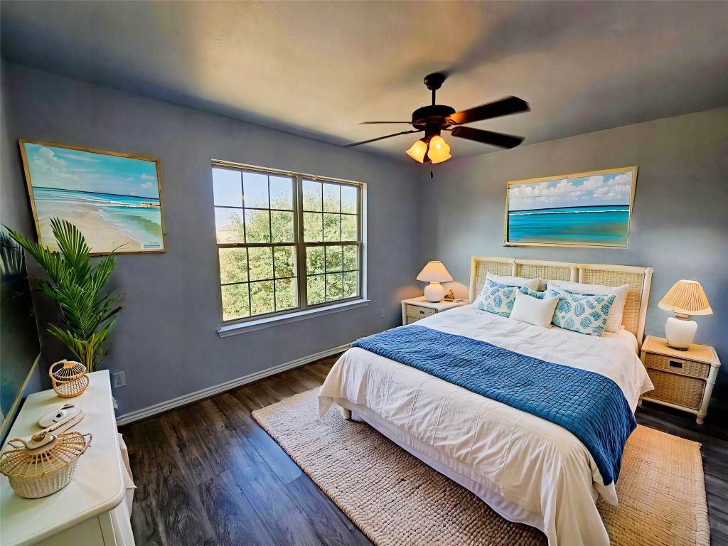 154 Sierra Rose Loop Georgetown, TX 78626 - Photo 6 of 13 a bedroom with a bed dresser and a window