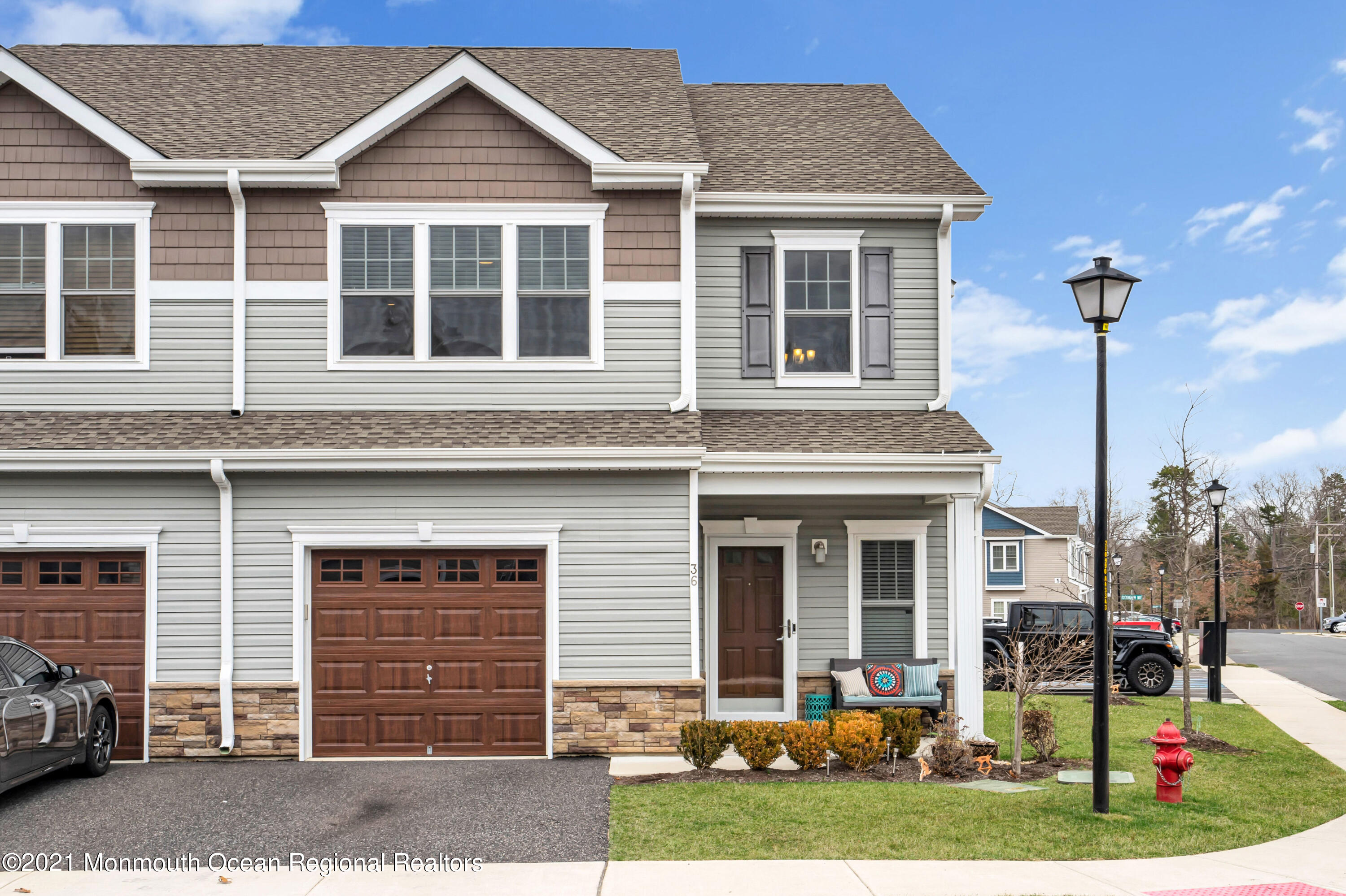 36 Rockingham Way Manchester Township, NJ 08759 - Photo 1 of 40 a front view of a house with a yard