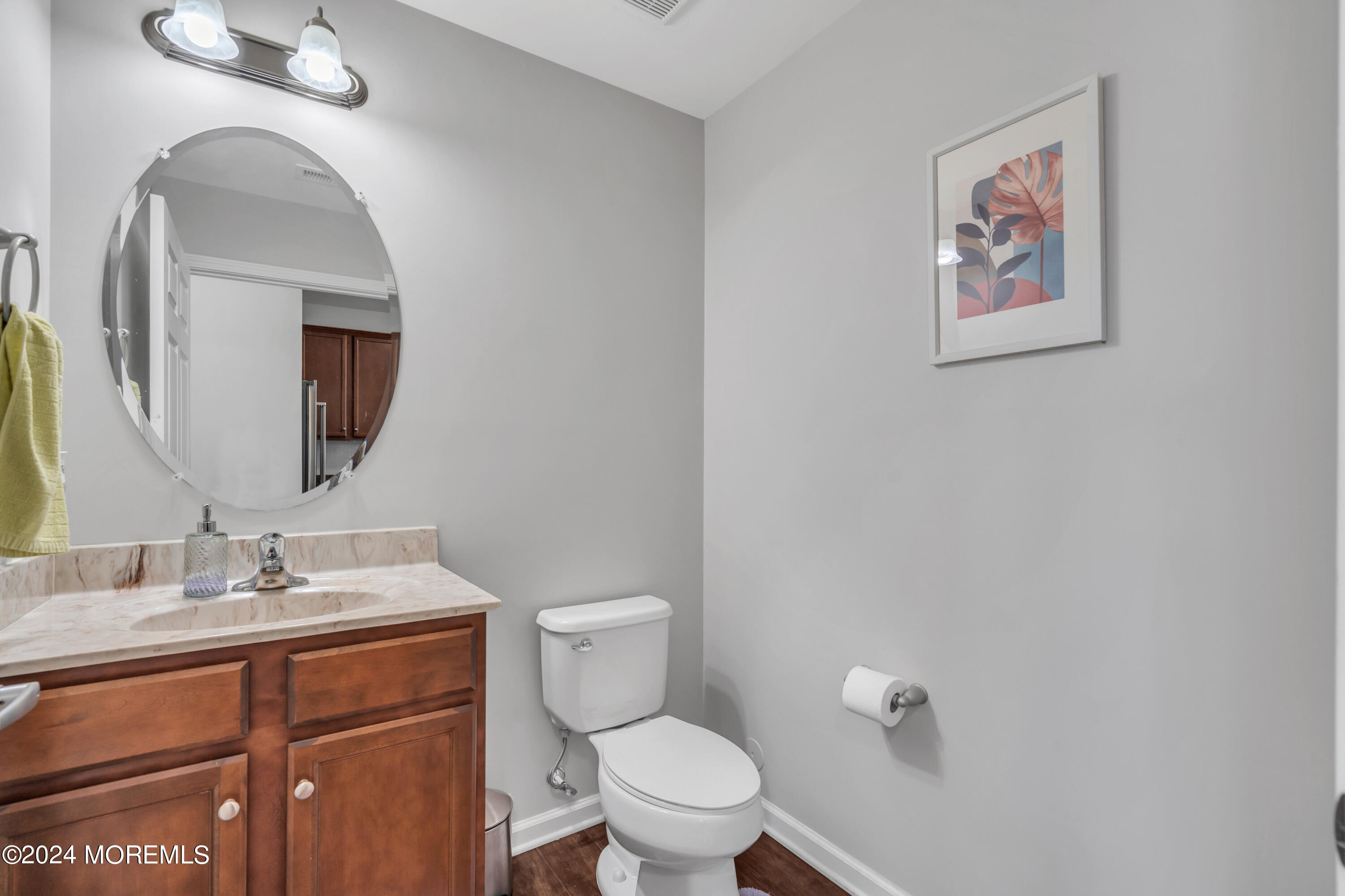36 Rockingham Way Manchester Township, NJ 08759 - Photo 21 of 40 a bathroom with a toilet a sink and mirror