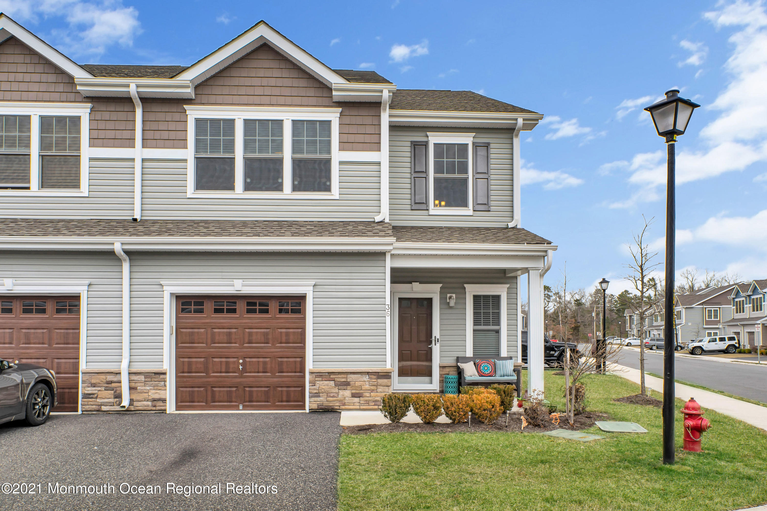 36 Rockingham Way Manchester Township, NJ 08759 - Photo 5 of 40 a front view of a house with garden