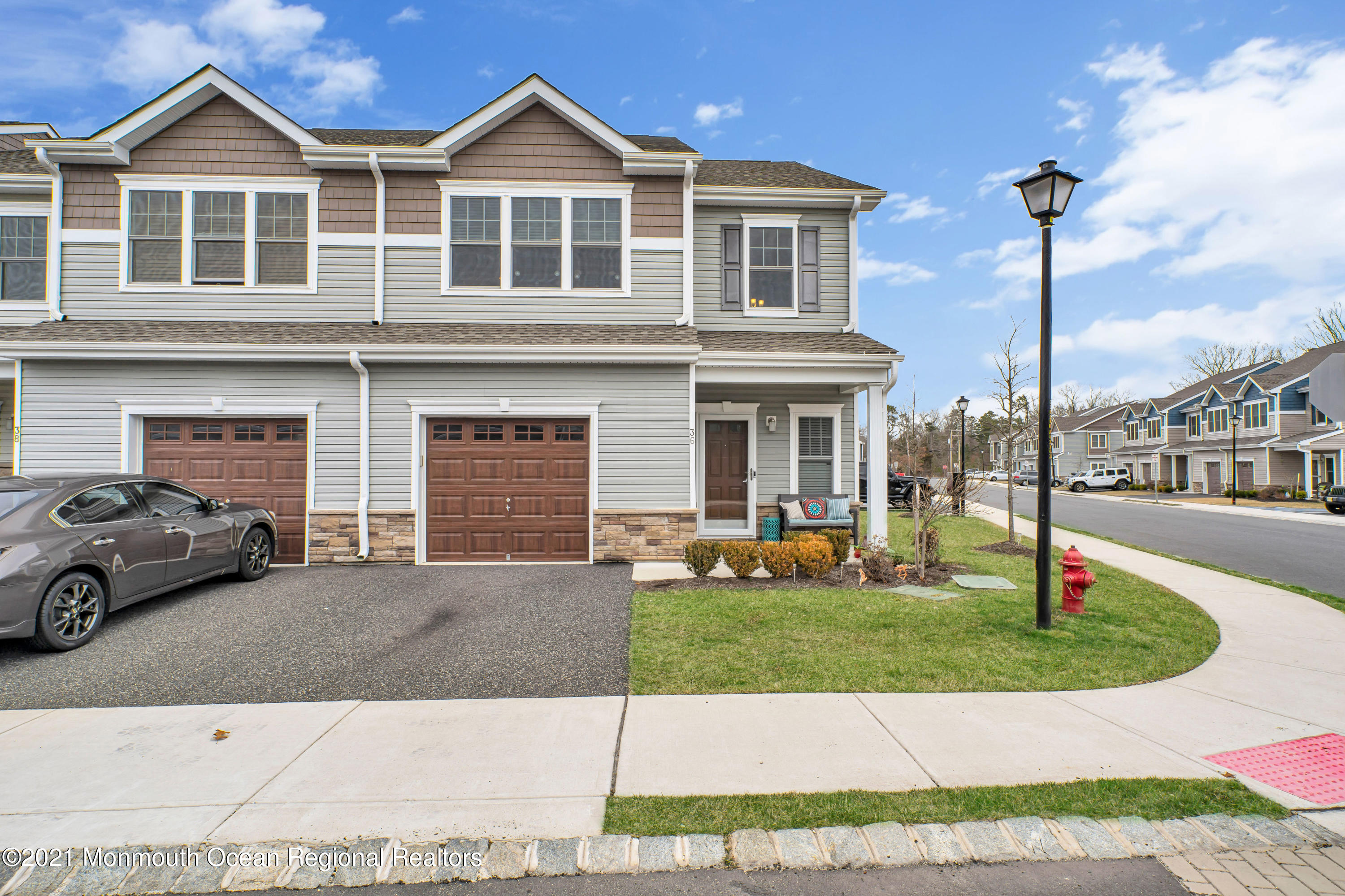 36 Rockingham Way Manchester Township, NJ 08759 - Photo 6 of 40 a front view of a house with a yard