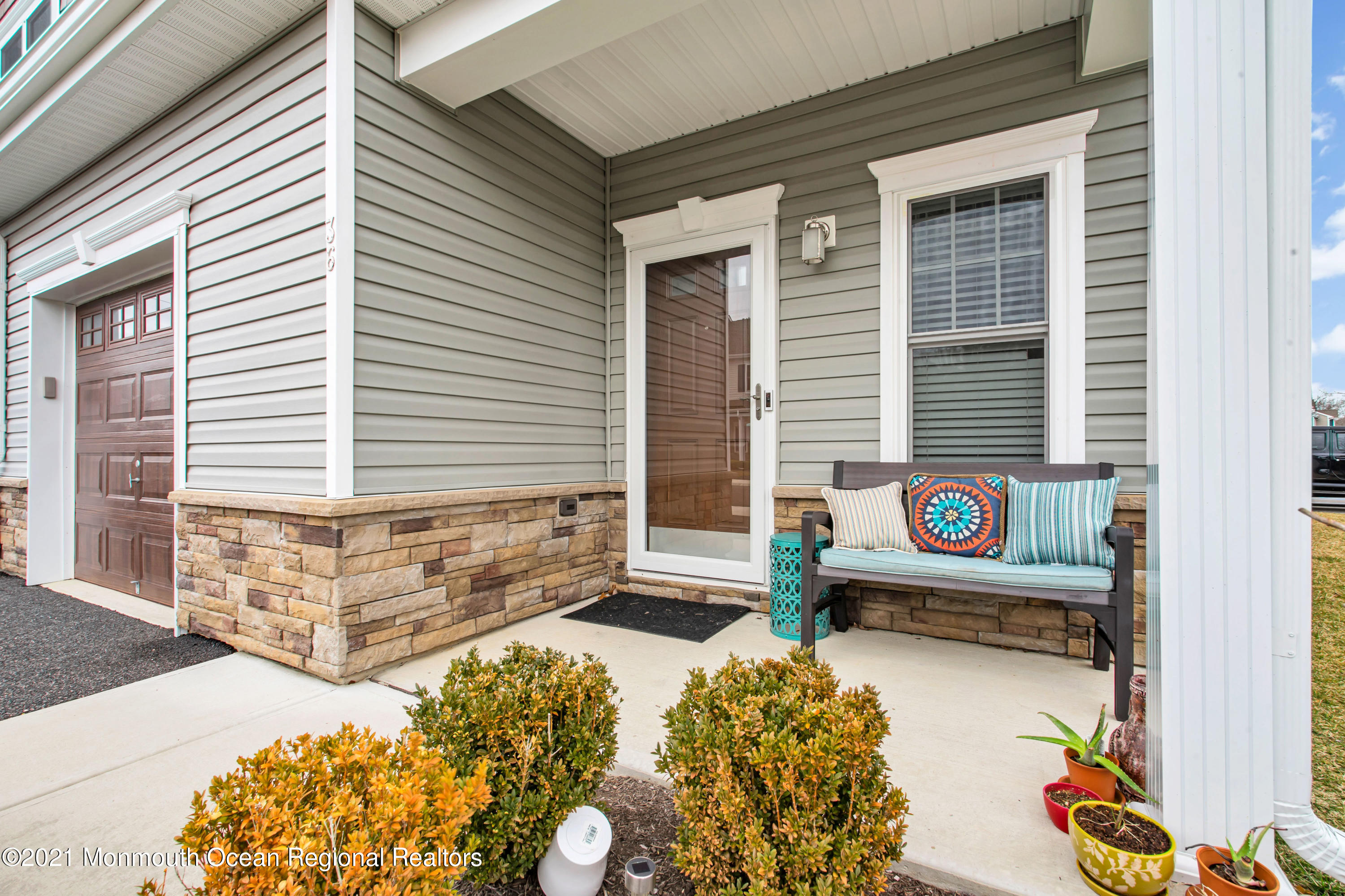 36 Rockingham Way Manchester Township, NJ 08759 - Photo 8 of 40 a front view of a house with many windows