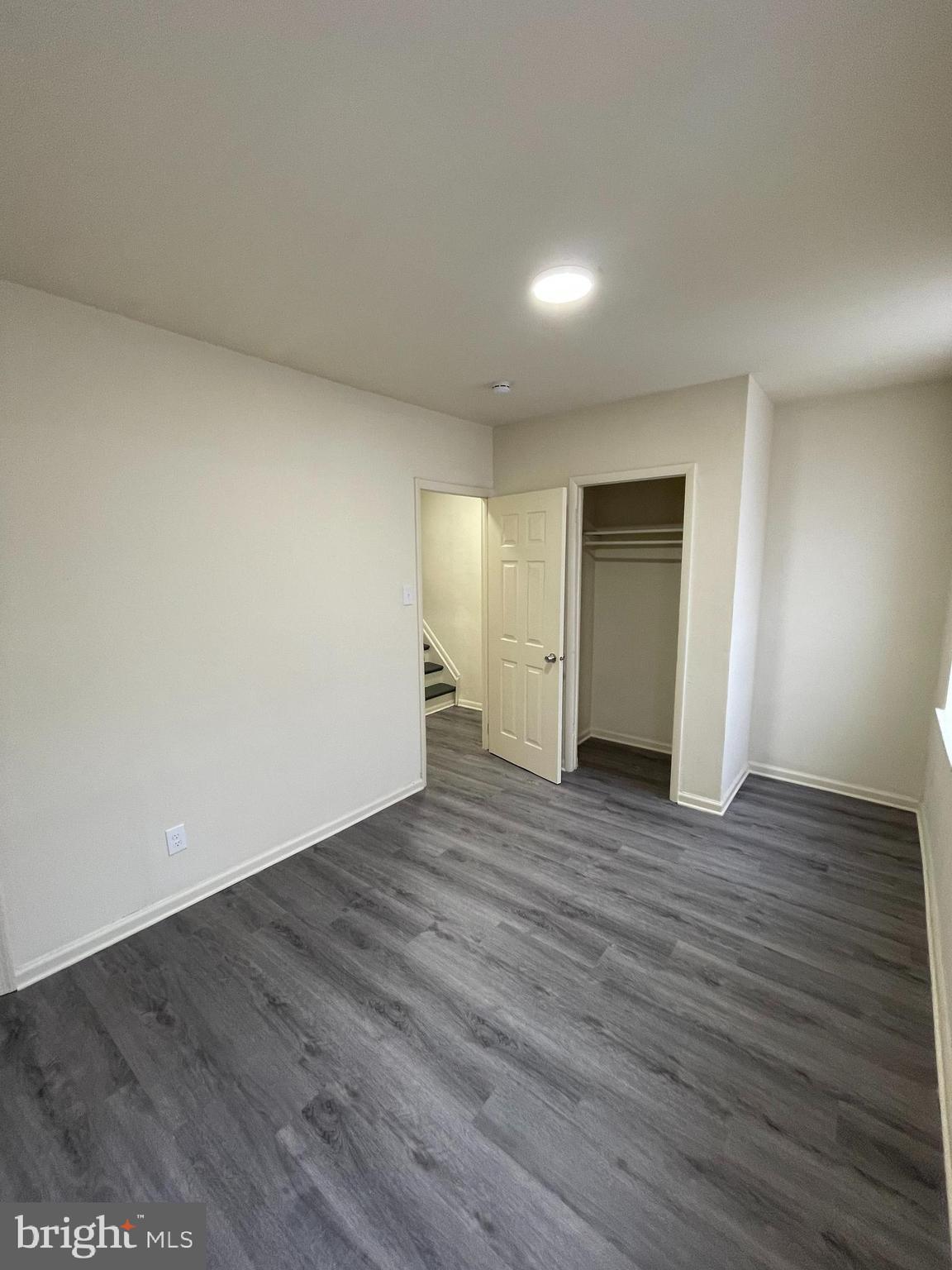 2441 North 5th Street Philadelphia, PA 19133 - Photo 11 of 18 a view of an empty room with wooden floor and closet