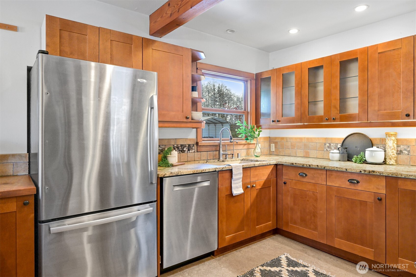 4186 Rural Avenue Bellingham, WA 98226 - Photo 10 of 40 a kitchen with stainless steel appliances granite countertop a refrigerator and a sink