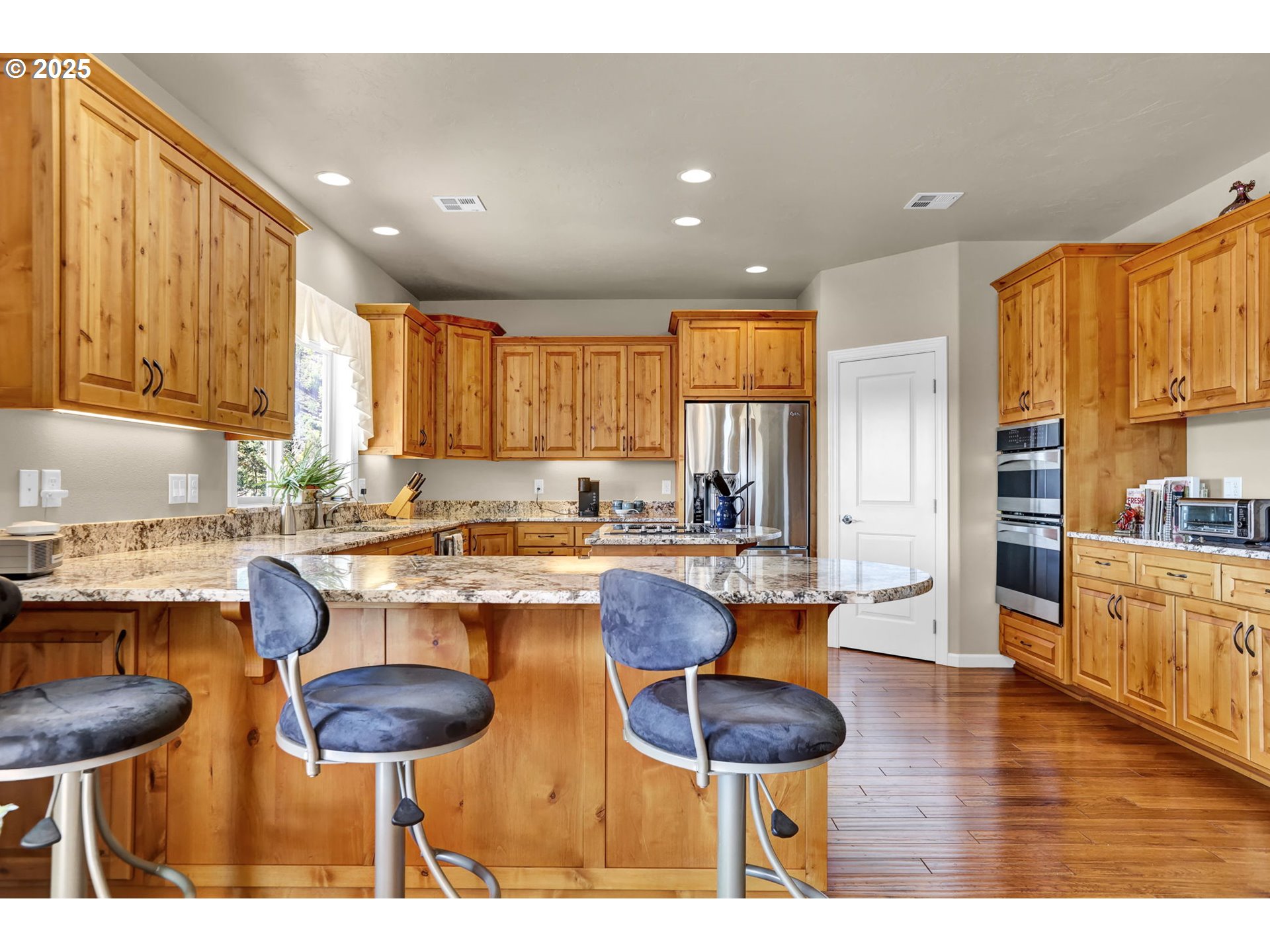 485 Andrews Road Yoncalla, OR 97499 - Photo 15 of 46 a kitchen with lots of counter top space and stainless steel appliances