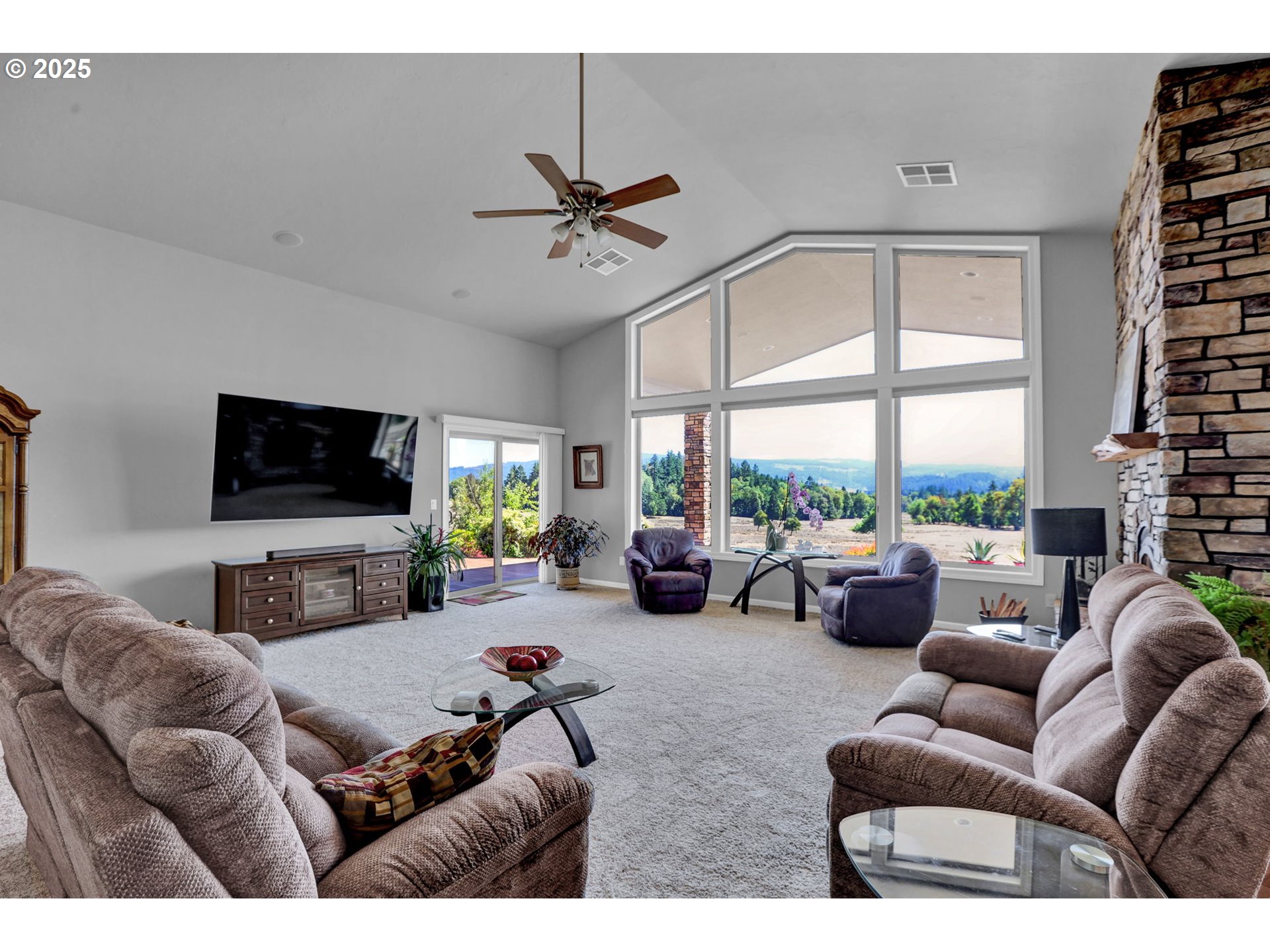 485 Andrews Road Yoncalla, OR 97499 - Photo 16 of 46 a living room with furniture and a flat screen tv
