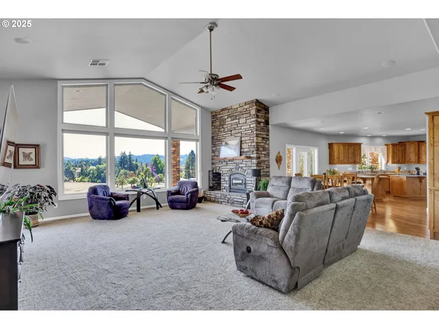 a kitchen with granite countertop a sink a stove and cabinets